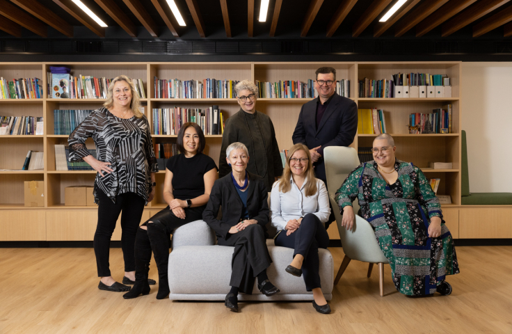 seven members of the UNSW Disability Innovation Institute are together. Standing are Terry Cumming, Leanne Dowse and Benjamin Garcia-Lee, and sitting are Lucy Sun, Jackie Leach Scully, Iva Strnadova and Yssy Burton-Clark