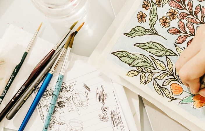Artist drawing on paper