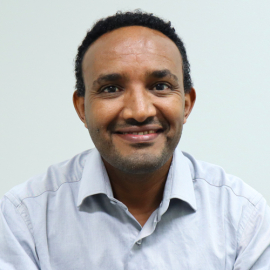 Amanuel smiling at the camera