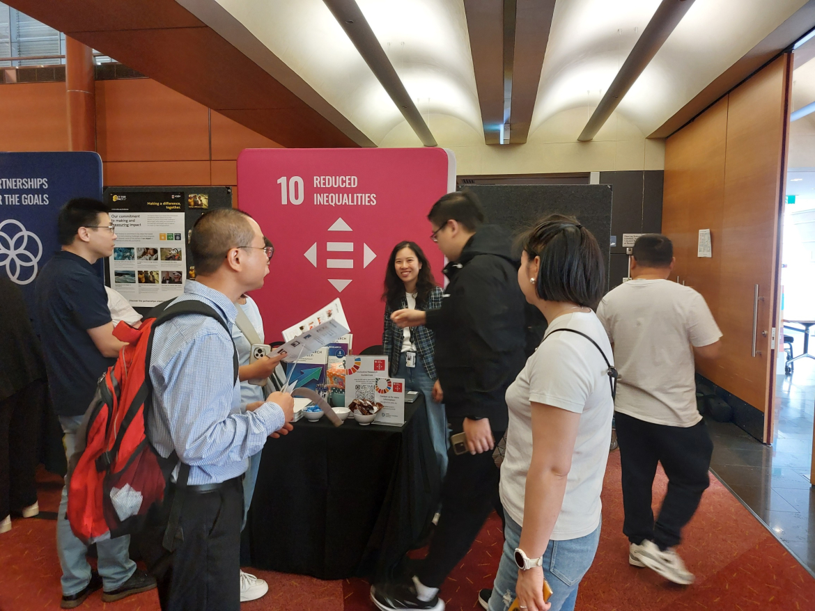 Dr Michelle Tso and guests at the stall