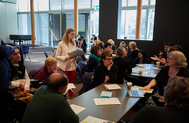 Teams working at the research showcase