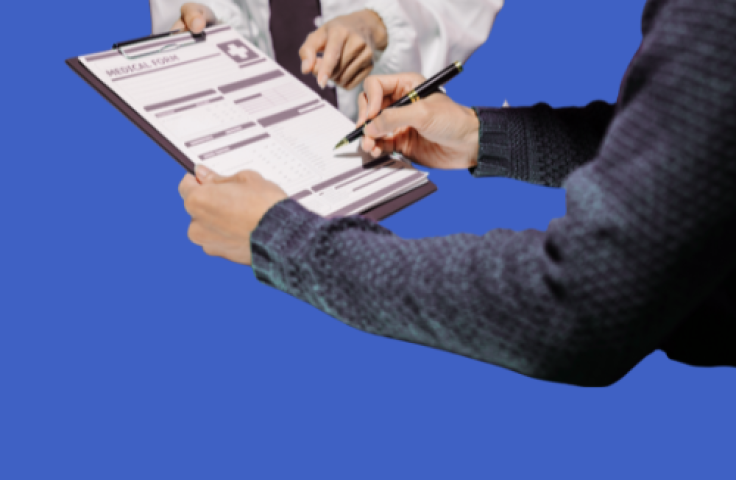 person filling out a medical consent form