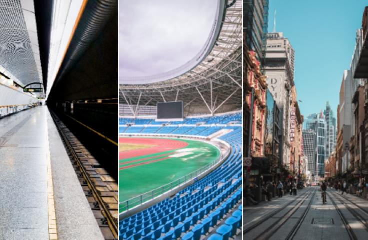 A train station, sporting stadium and city street scape. 