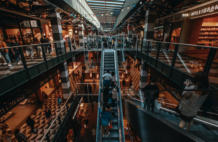 Multiple levels of a shopping centre, with escalators connecting them