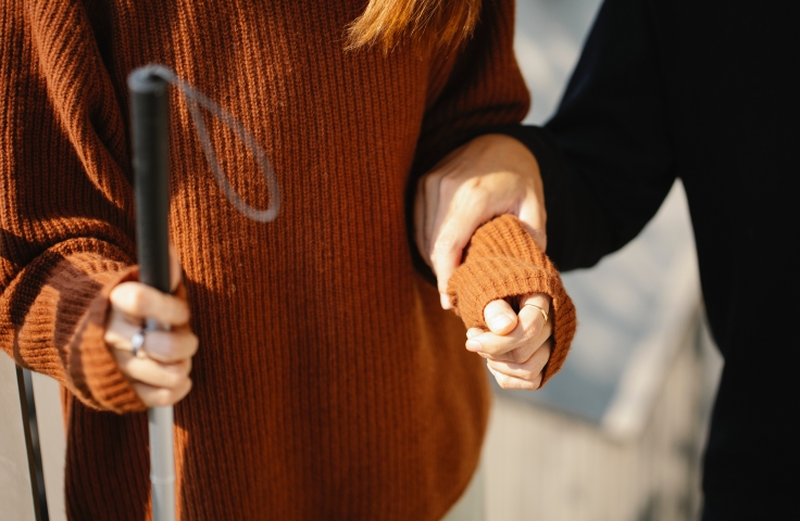 Photo of a man holding a womans arm