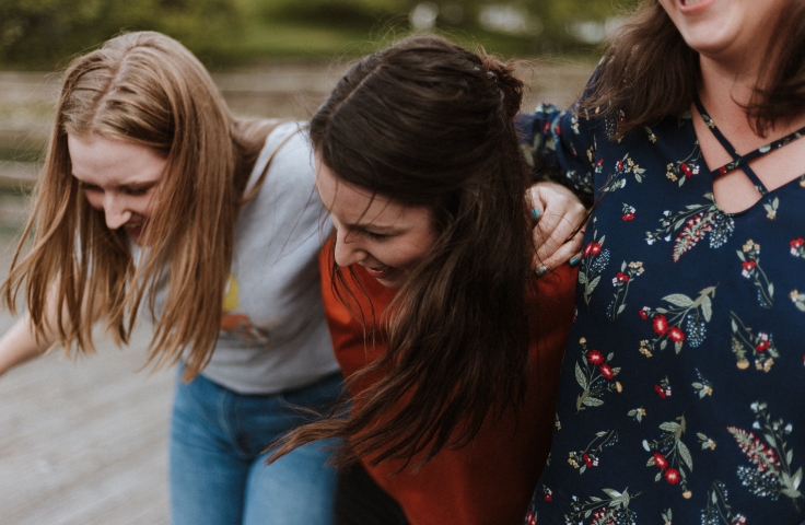 3 women arm in arm